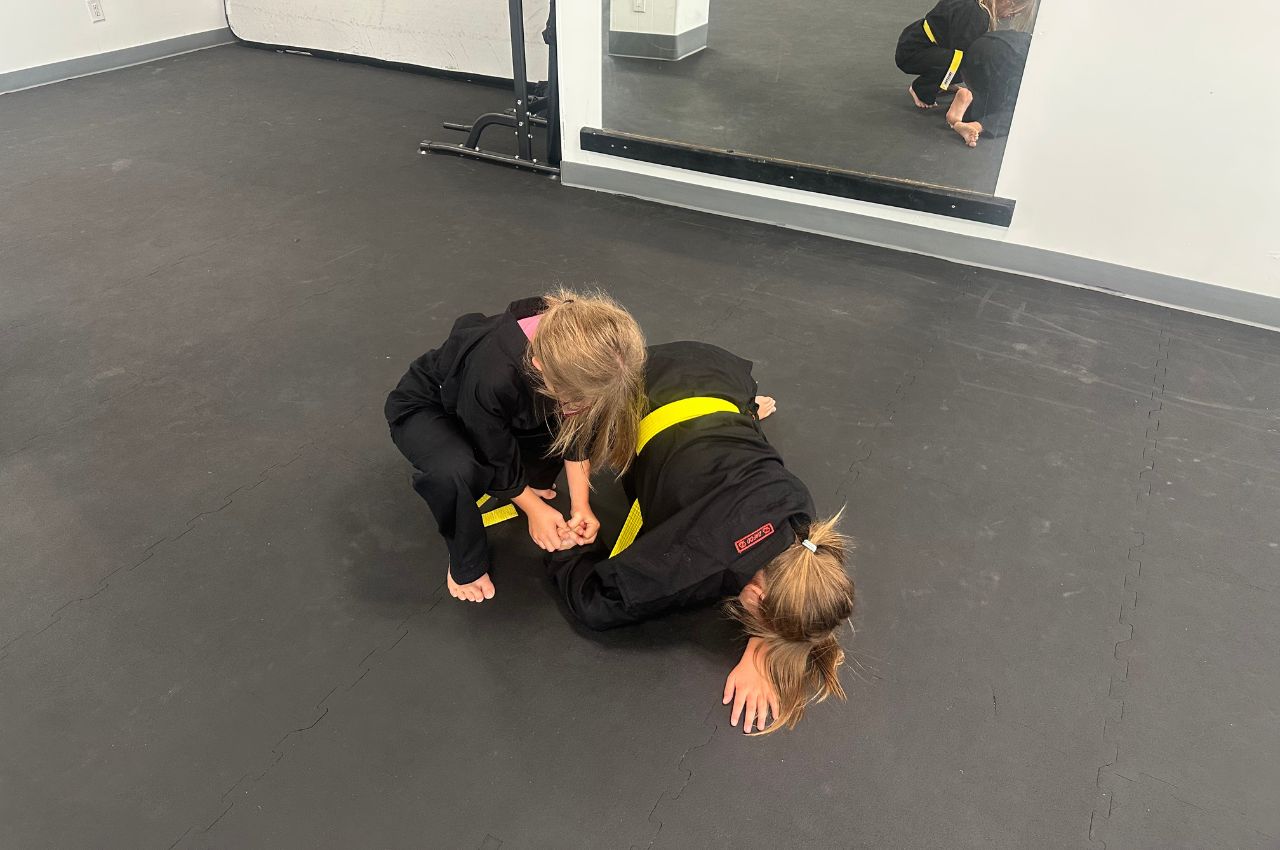 Martial arts instructor with kids