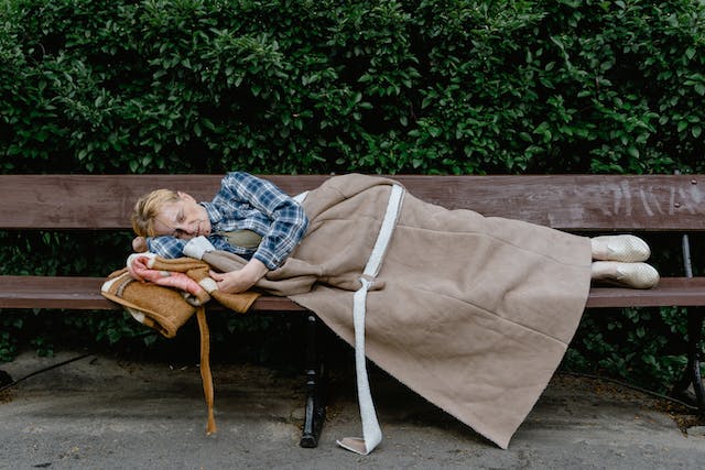 homeless sleeping on bench homeless sleeping on bench