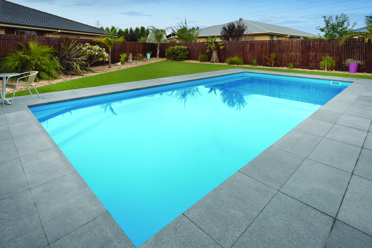 Fiberglass pool integrated into backyard