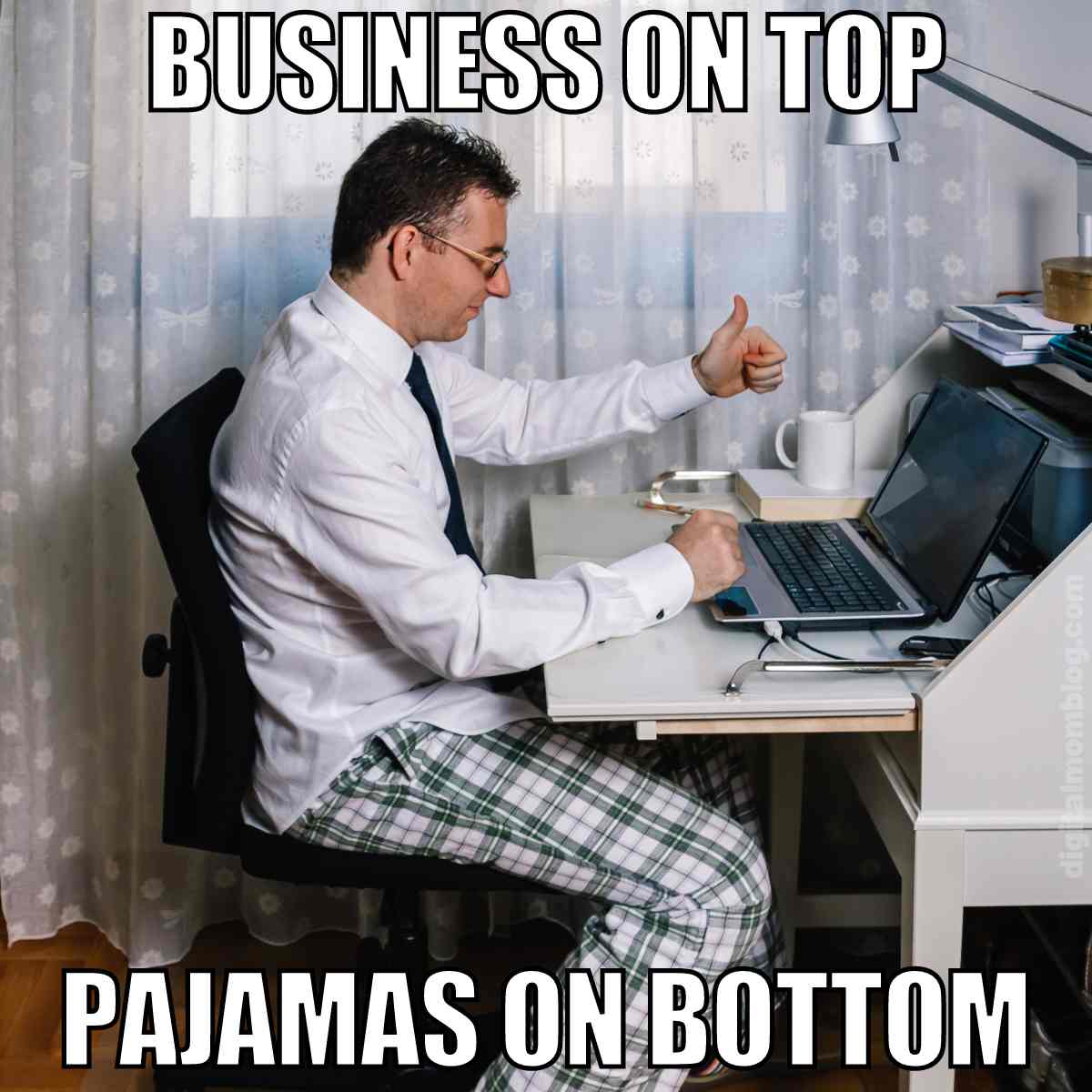 man working at laptop with pajama bottoms and business shirt and tie