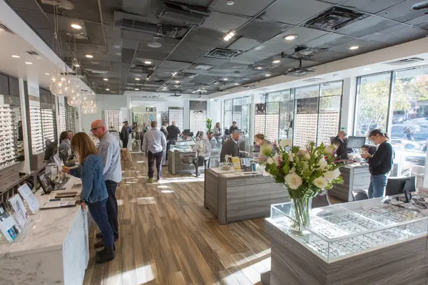 Thriving luxury optical boutique interior in Marin County showing increased patient traffic and engagement