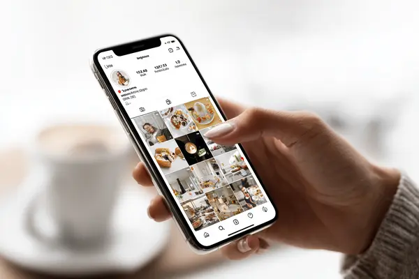 Instagram carousel post on smartphone demonstrating multiple slides with custom alt text for improved algorithm performance