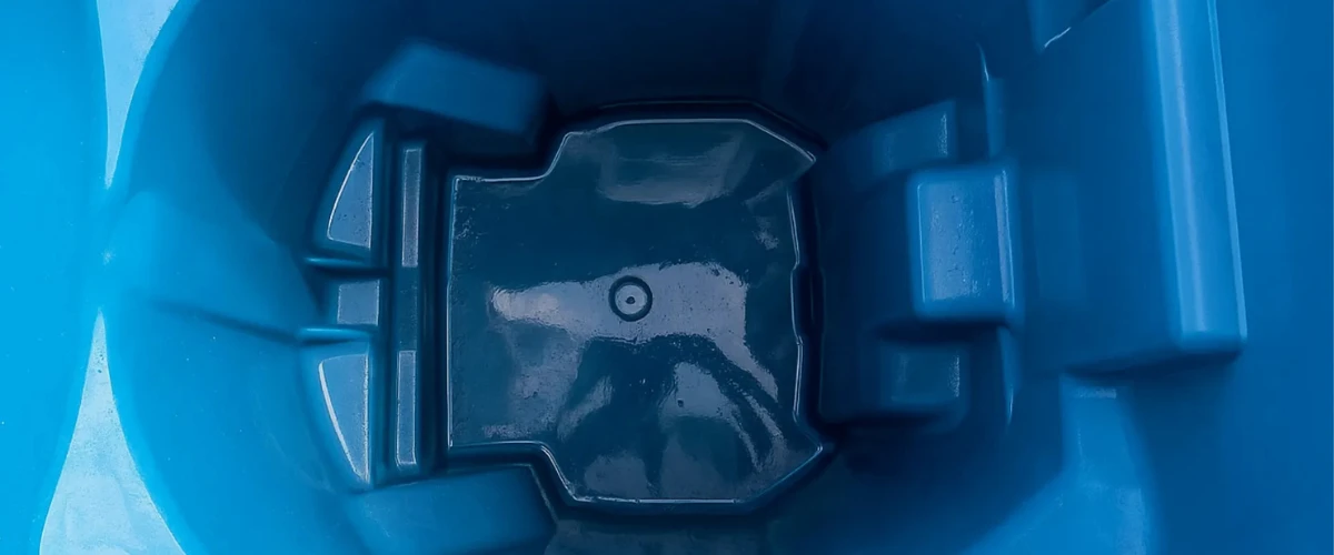 Inside view of a clean blue recycling bin after thorough sanitation.