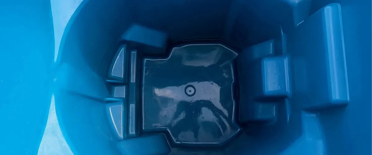 Sanitized blue trash bin interior after professional bin cleaning service.