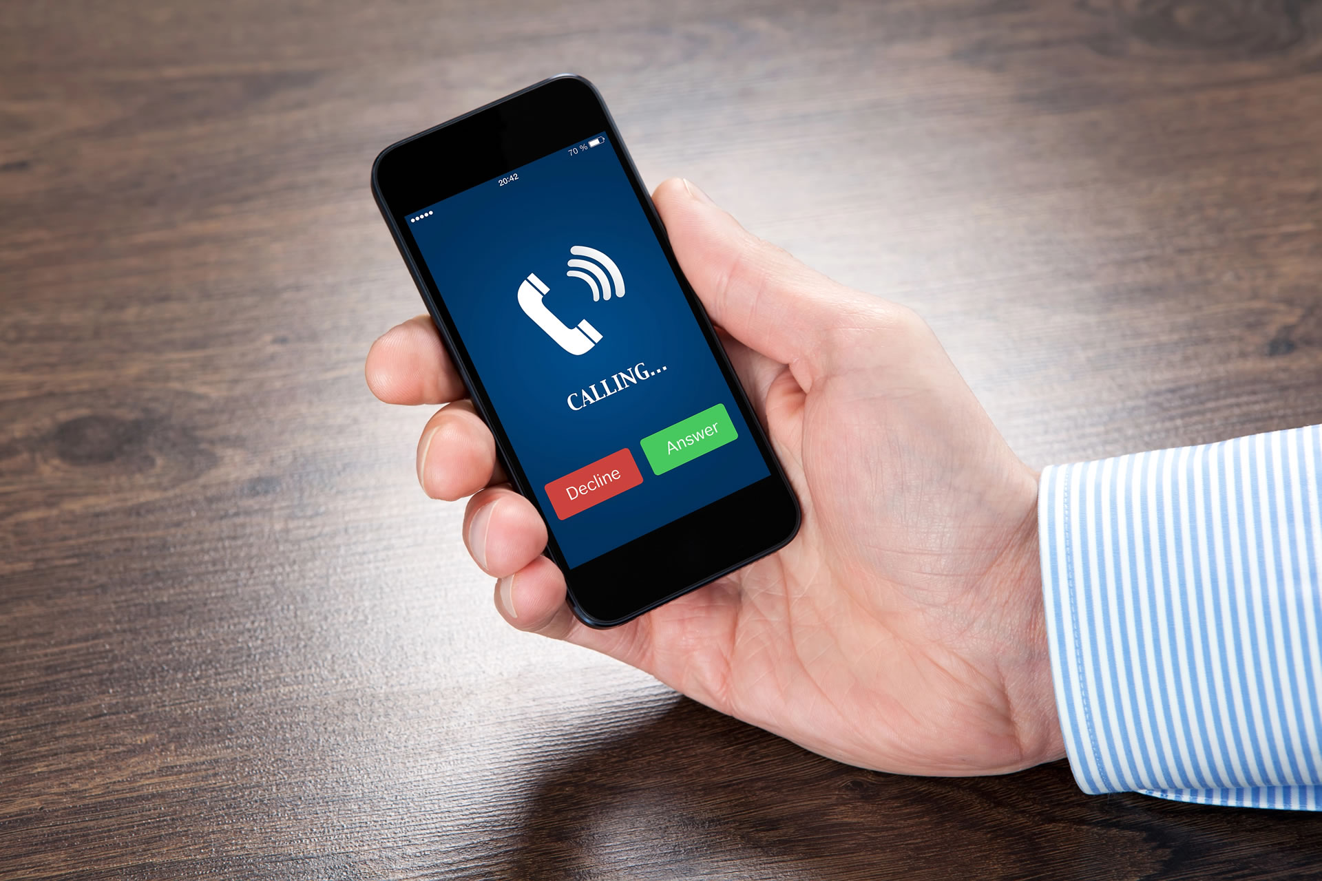 businessman-holding-a-phone-with-blue-screen-and-the-phone