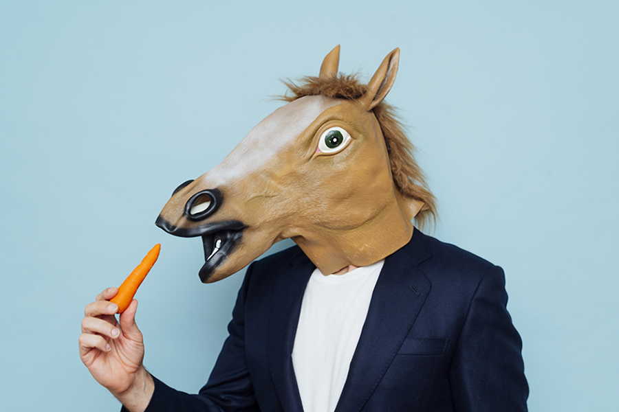Horsehead man holding a carrot Horsehead man holding a carrot
