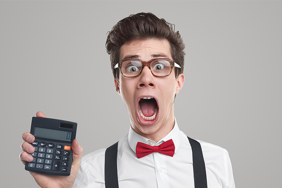 Marketing guy holding up a calculator Marketing guy holding up a calculator