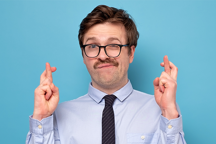 Funny Businessman crossing his fingers Funny Businessman crossing his fingers
