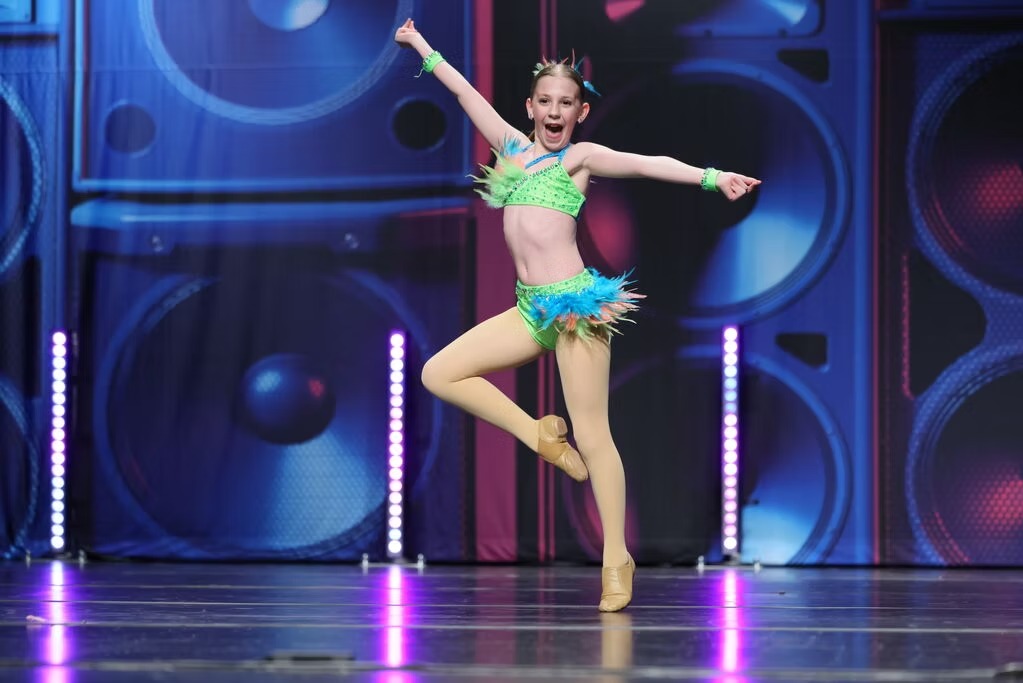 Ballet competition team performing at regional dance event