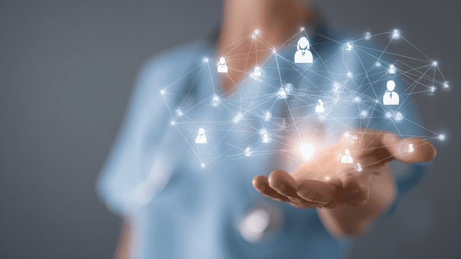 A recruiter holding a glowing digital network of connected candidate icons, representing AI-powered outreach automation that accelerates lead engagement and business growth.