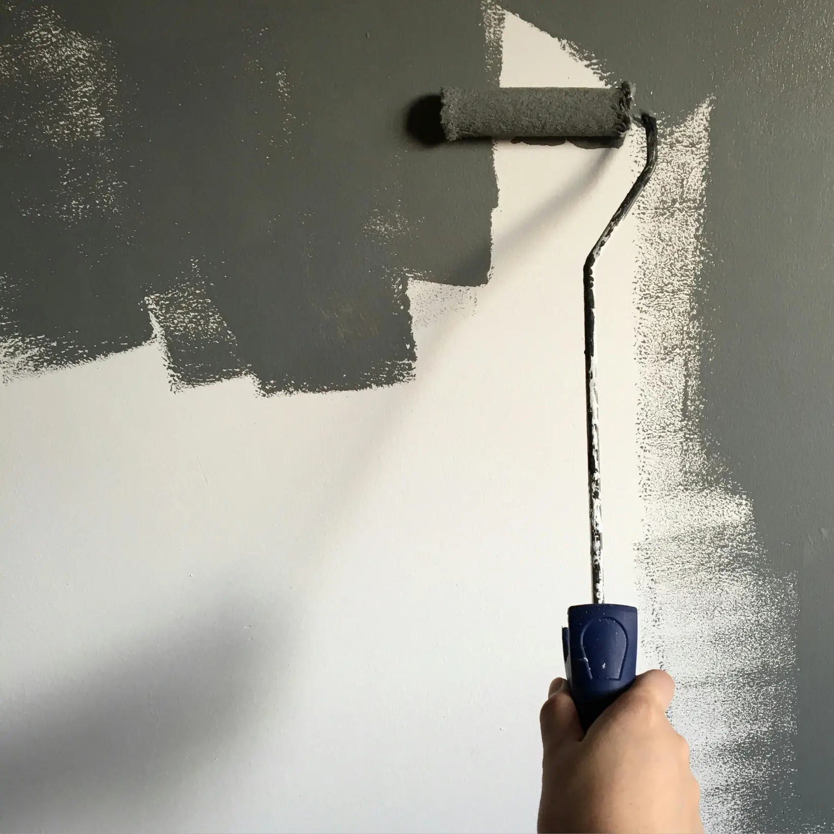 sample image of a hand holding a paint roller doing a paint job