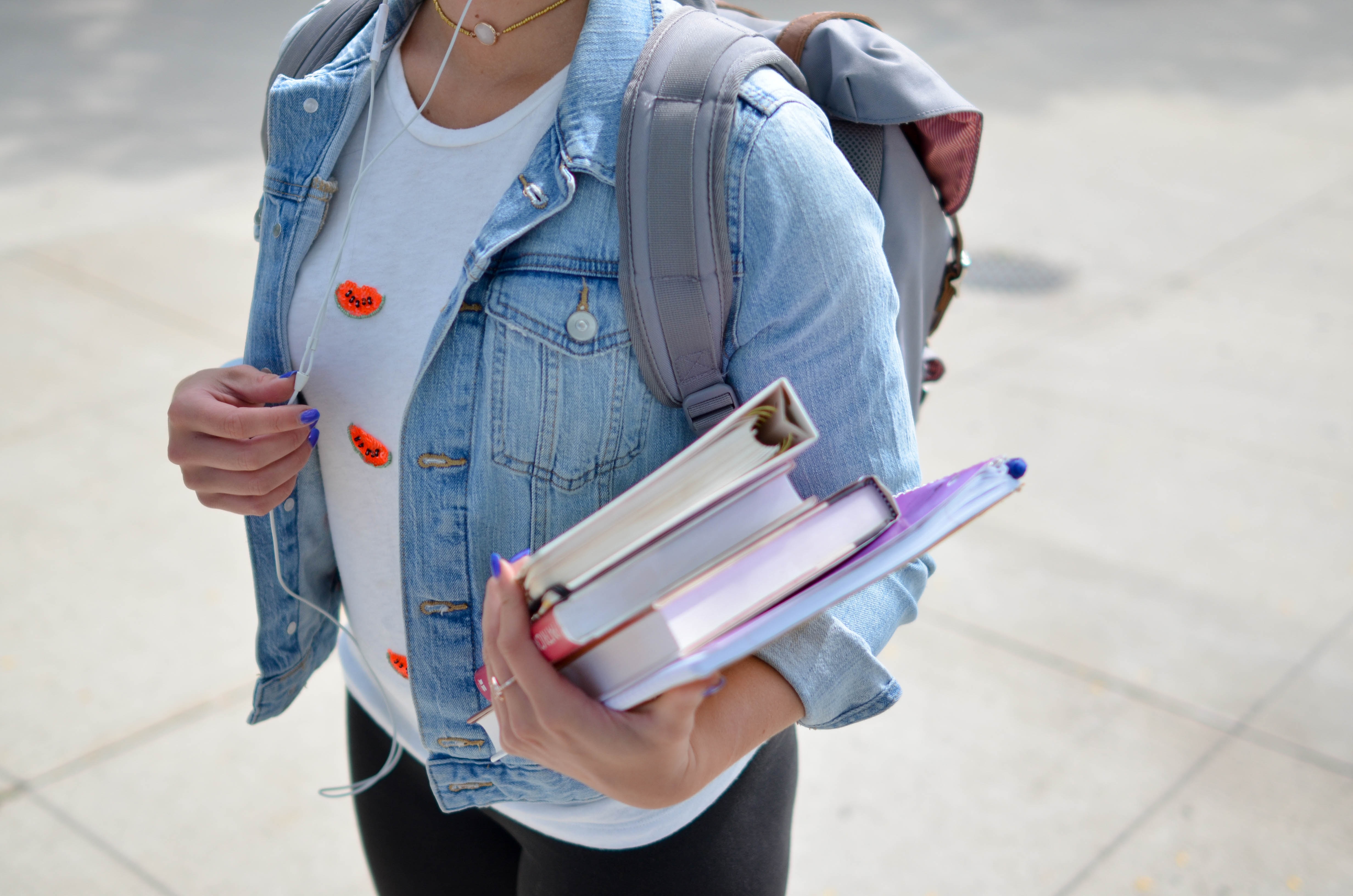 child_holding_books