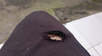 A ripped pair of dress pants that need to be thrown out A ripped pair of dress pants that need to be thrown out