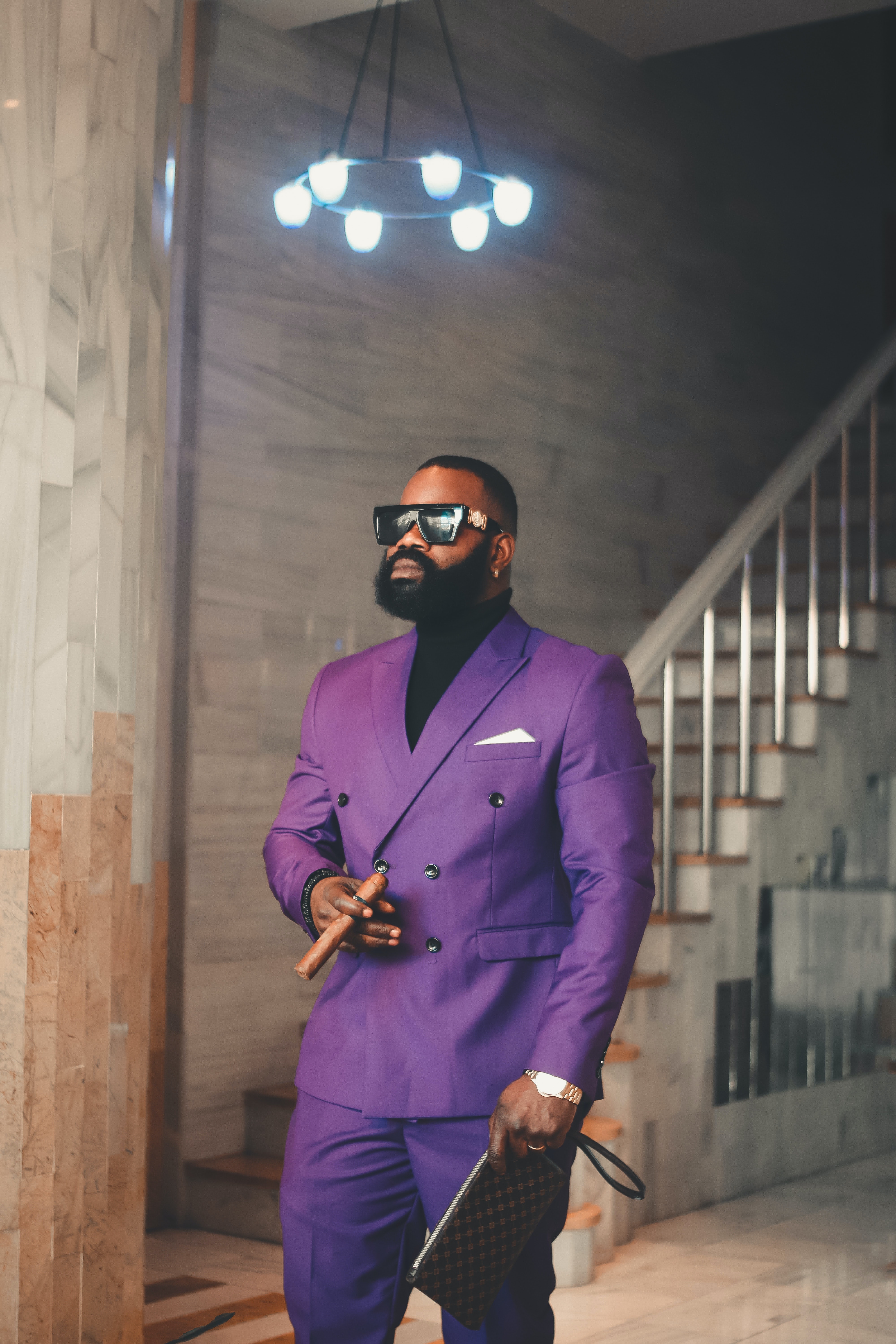 A man in a stylish purple custom suit A man in a stylish purple custom suit