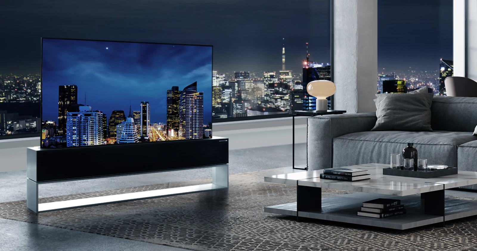 a large TV in a big fancy city apartment.