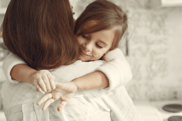 Mom and Daughter Hugging Securely