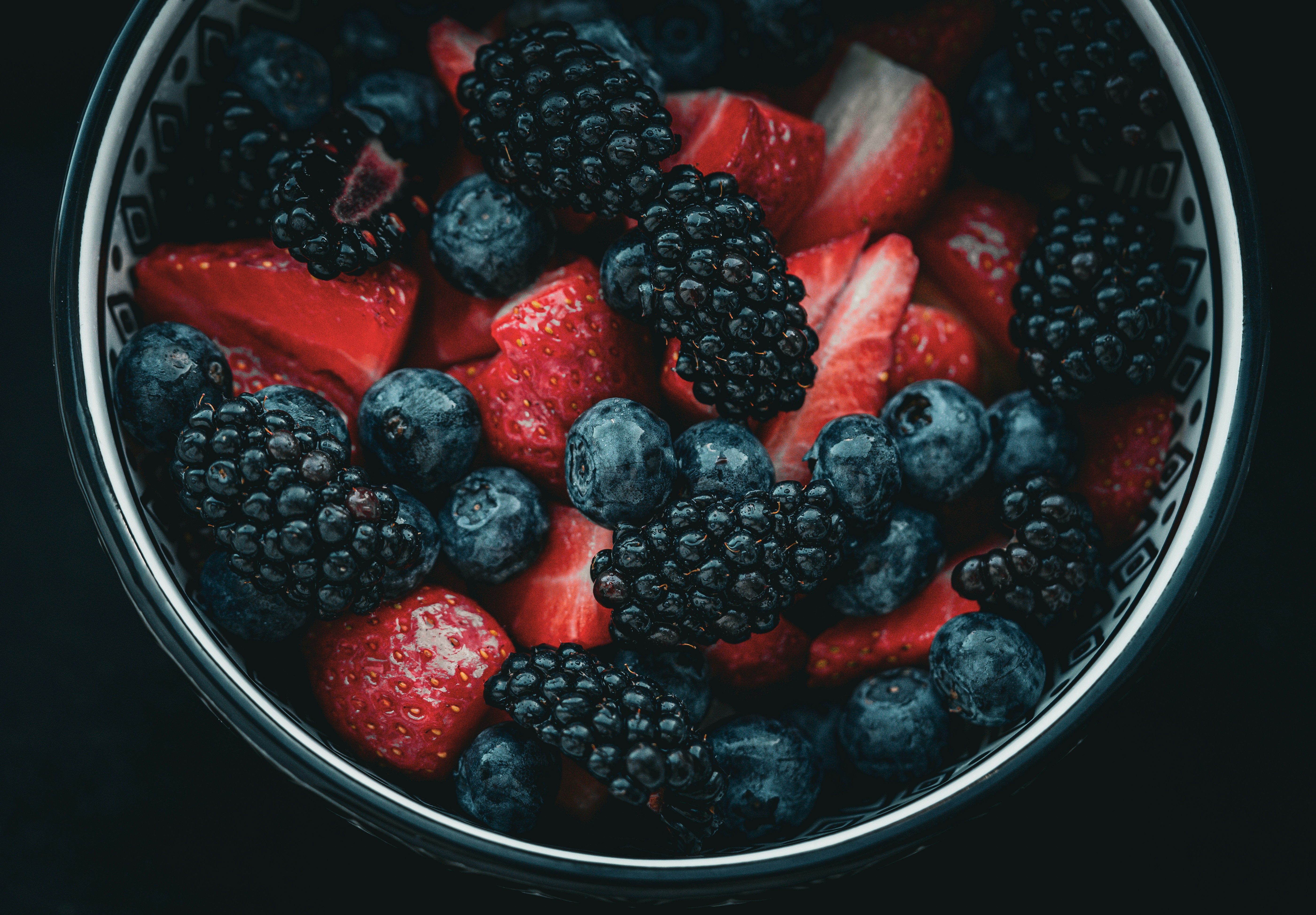 bowl of blackberries, strawberries and blueberries bowl of blackberries, strawberries and blueberries