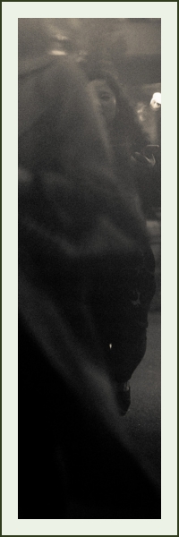 An over-the-shoulder view of a woman's hands on a laptop keyboard as she manages a Google calendar.