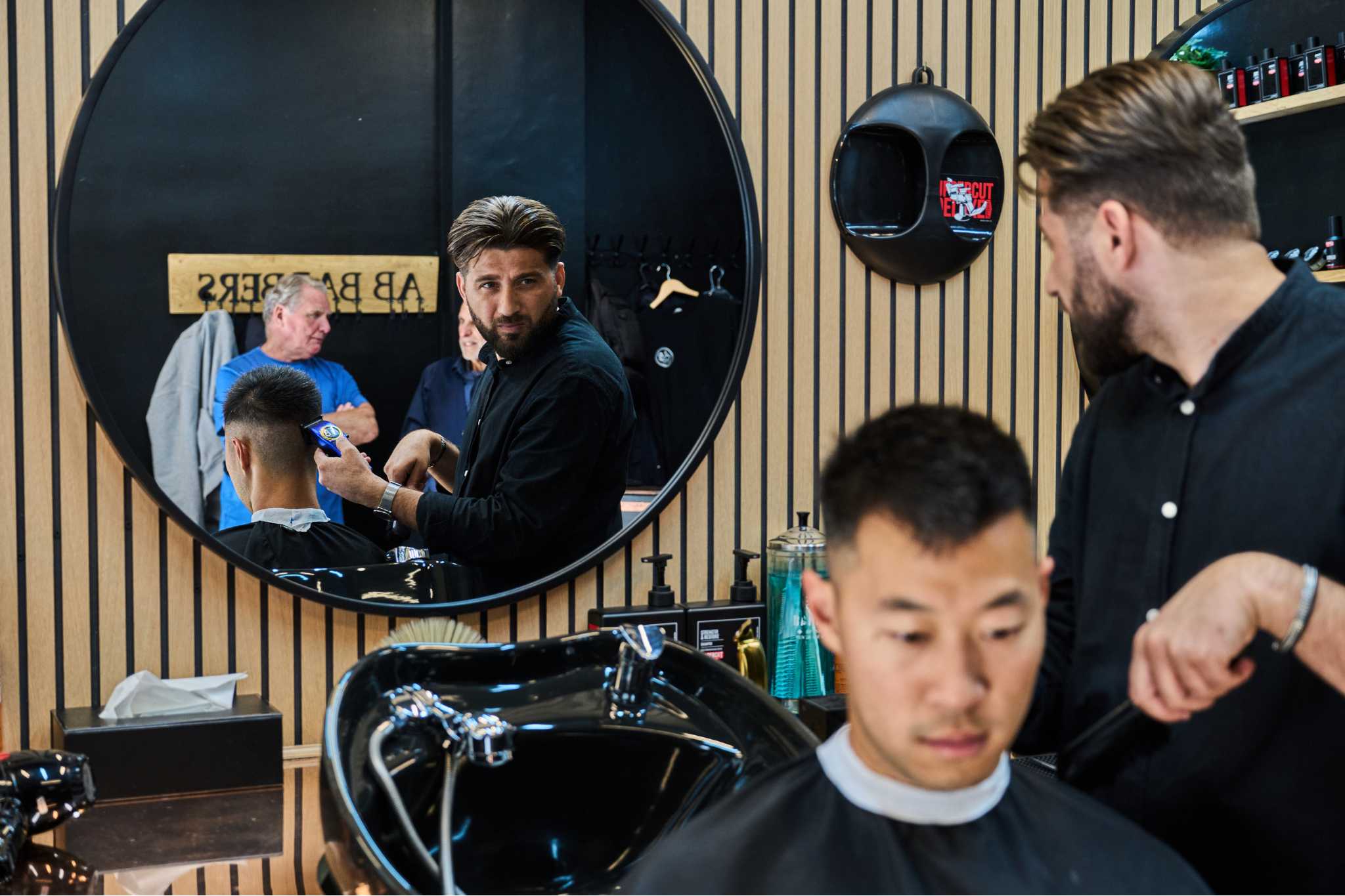 Barber posing in mirror