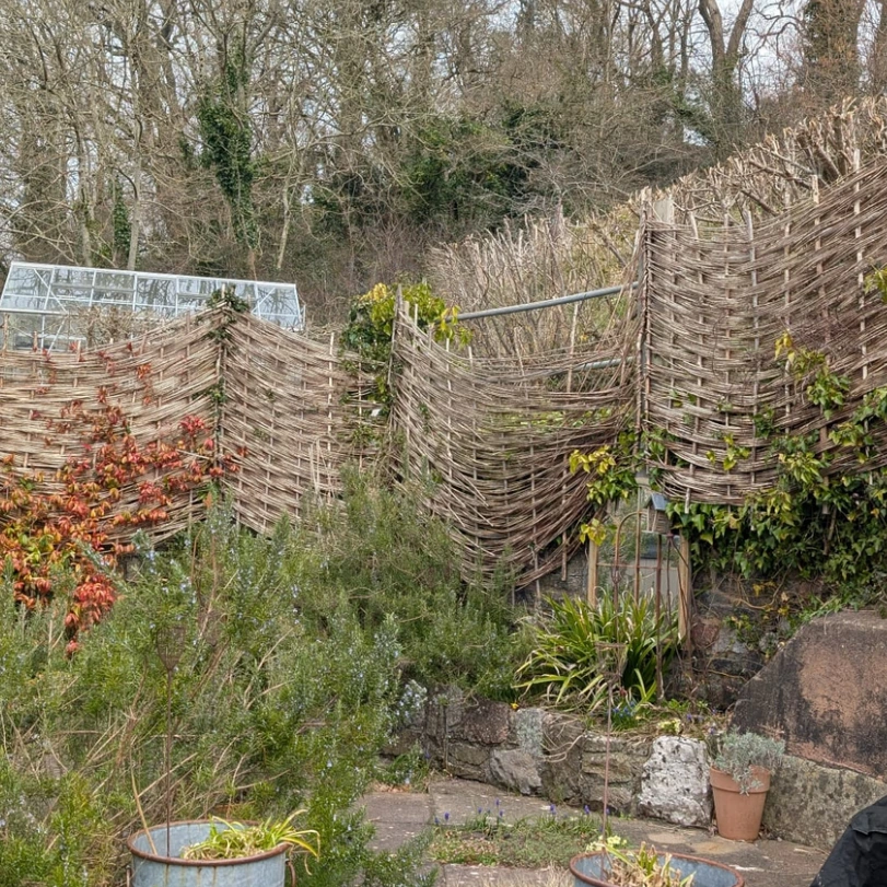 wooden fence being built by moore dunn fencing in torquay devon