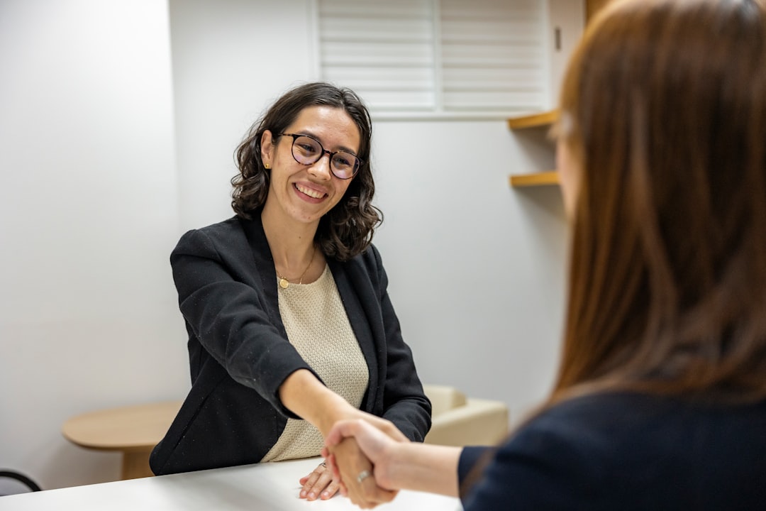 Women in a business interview shaking hands