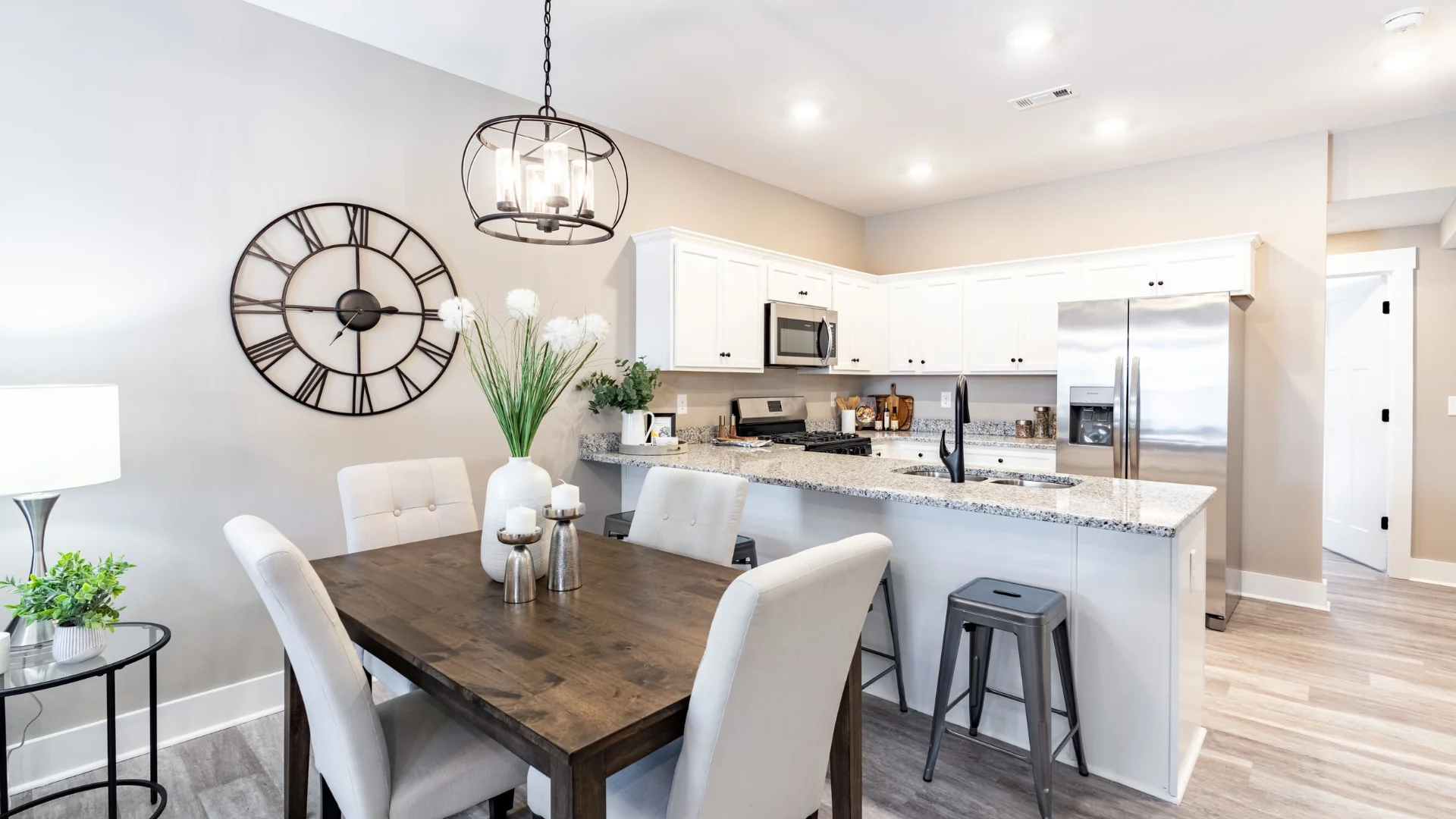 Legacy Townhomes kitchen and dining with granite countertops, stainless appliances, and open floor plan in Manchester, TN.