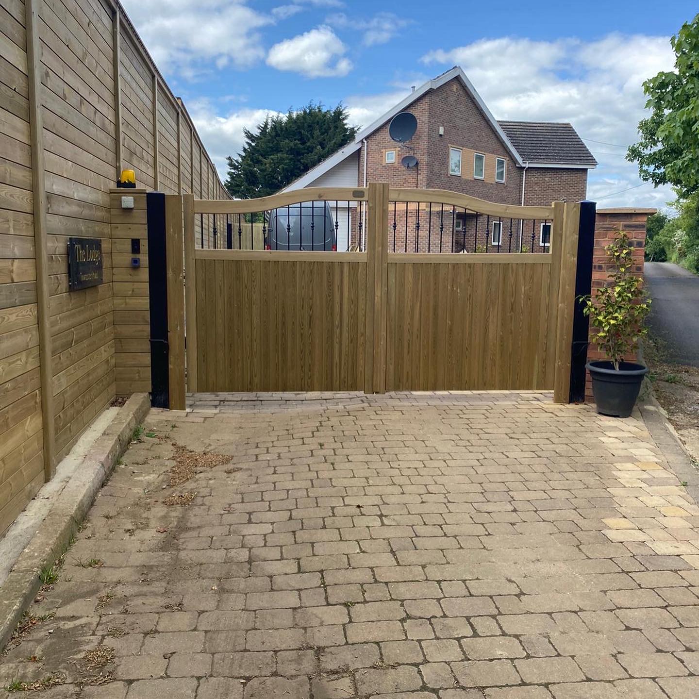 Custom-built timber entrance gates installed by Creative Scapes in Oxfordshire Custom-built timber entrance gates installed by Creative Scapes in Oxfordshire