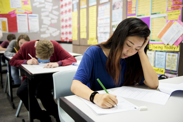 teens taking an exam teens taking an exam