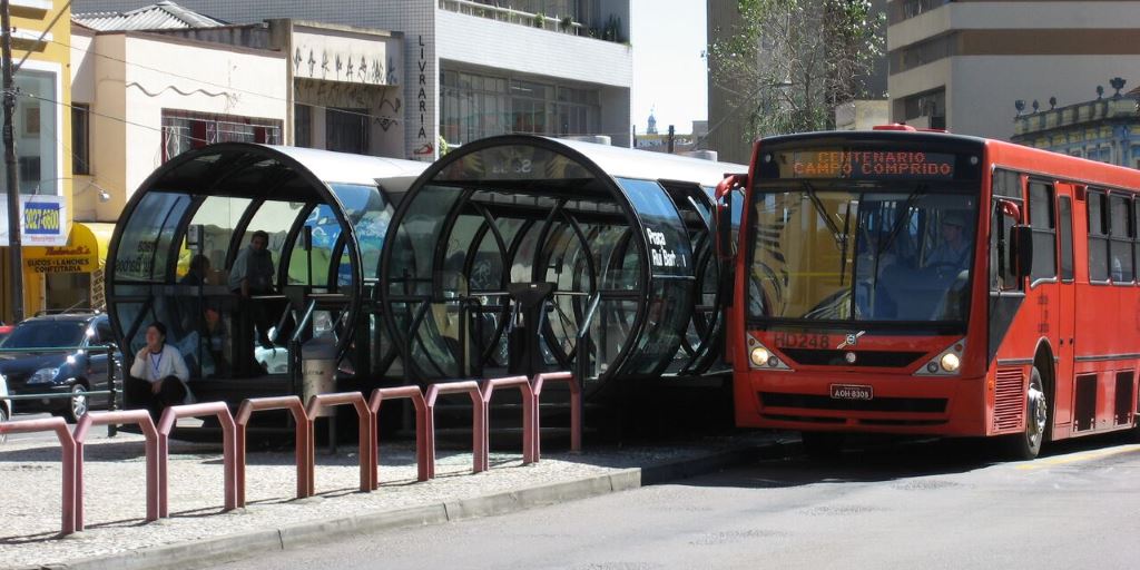 Curitiba's bus rapid transit system with specially designed stations and buses operating on dedicated lanes, demonstrating efficient urban public transportation. Curitiba's bus rapid transit system with specially designed stations and buses operating on dedicated lanes, demonstrating efficient urban public transportation.