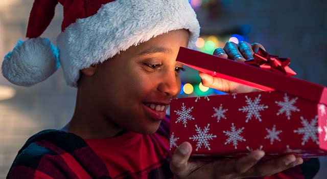 Winter hats, mittens, and wrapped gifts