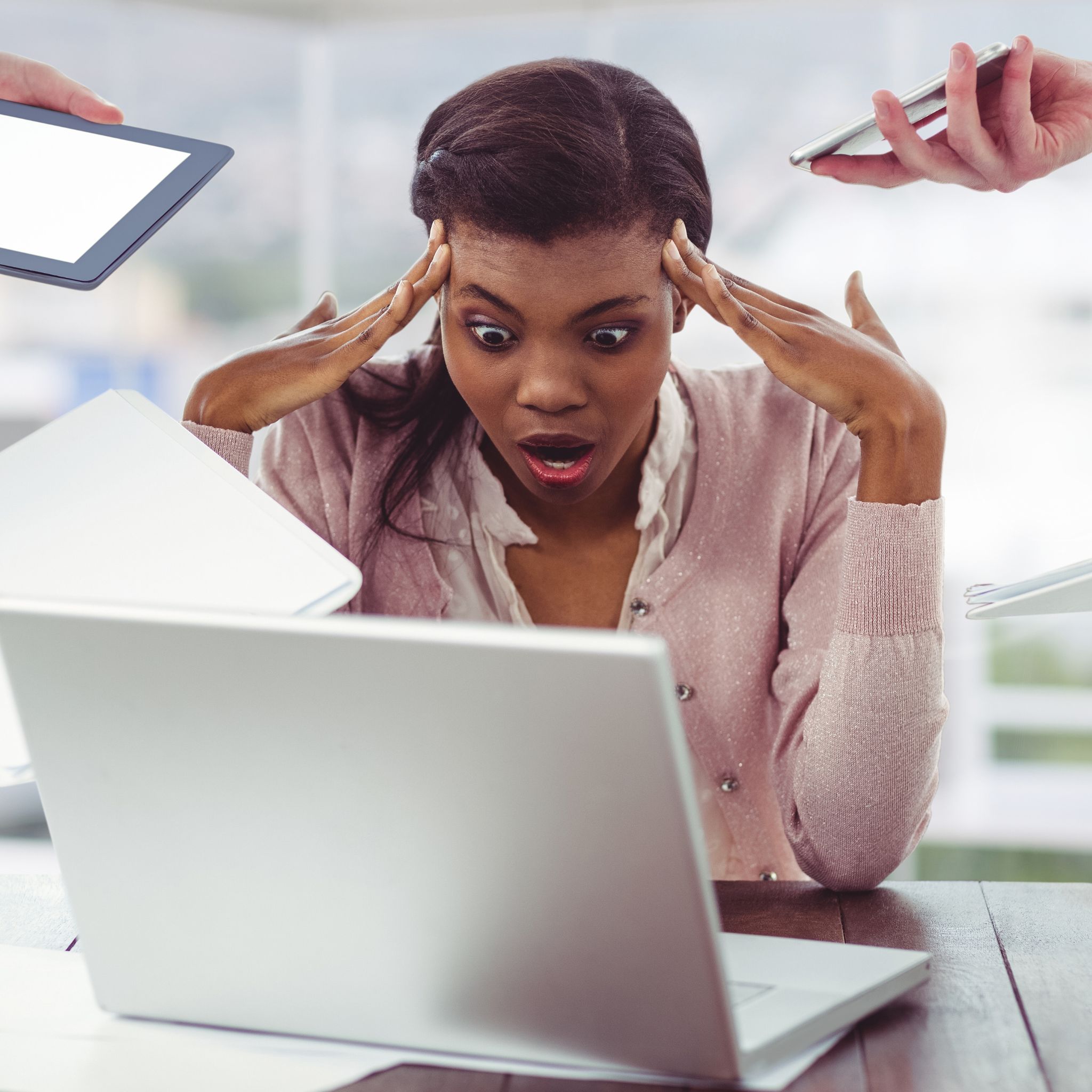 A female entrepreneur looks overwhelmed by the chaos of managing leads from her laptop, phone, and tablet, representing the common pain points in sales and marketing for small businesses. A female entrepreneur looks overwhelmed by the chaos of managing leads from her laptop, phone, and tablet, representing the common pain points in sales and marketing for small businesses.