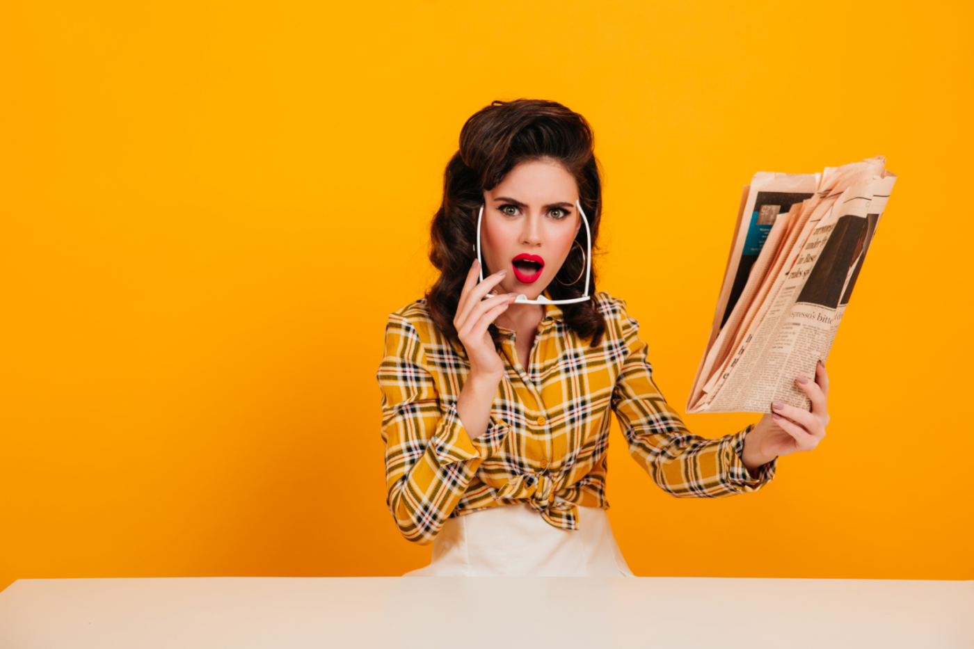 woman reading a newspaper