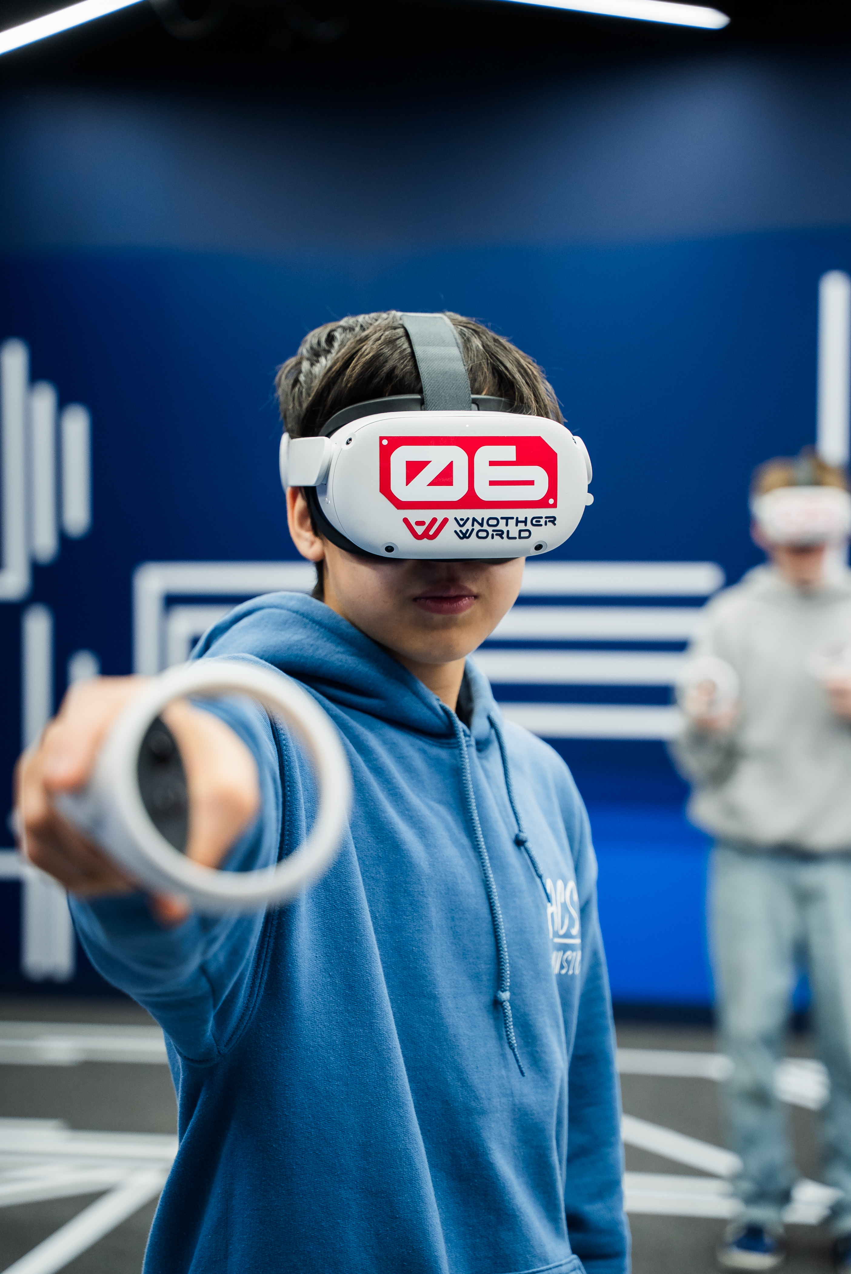 SD35 Langley Student wearing an another world vr (Virtual reality) headset and playing VR SD35 Langley Student wearing an another world vr (Virtual reality) headset and playing VR