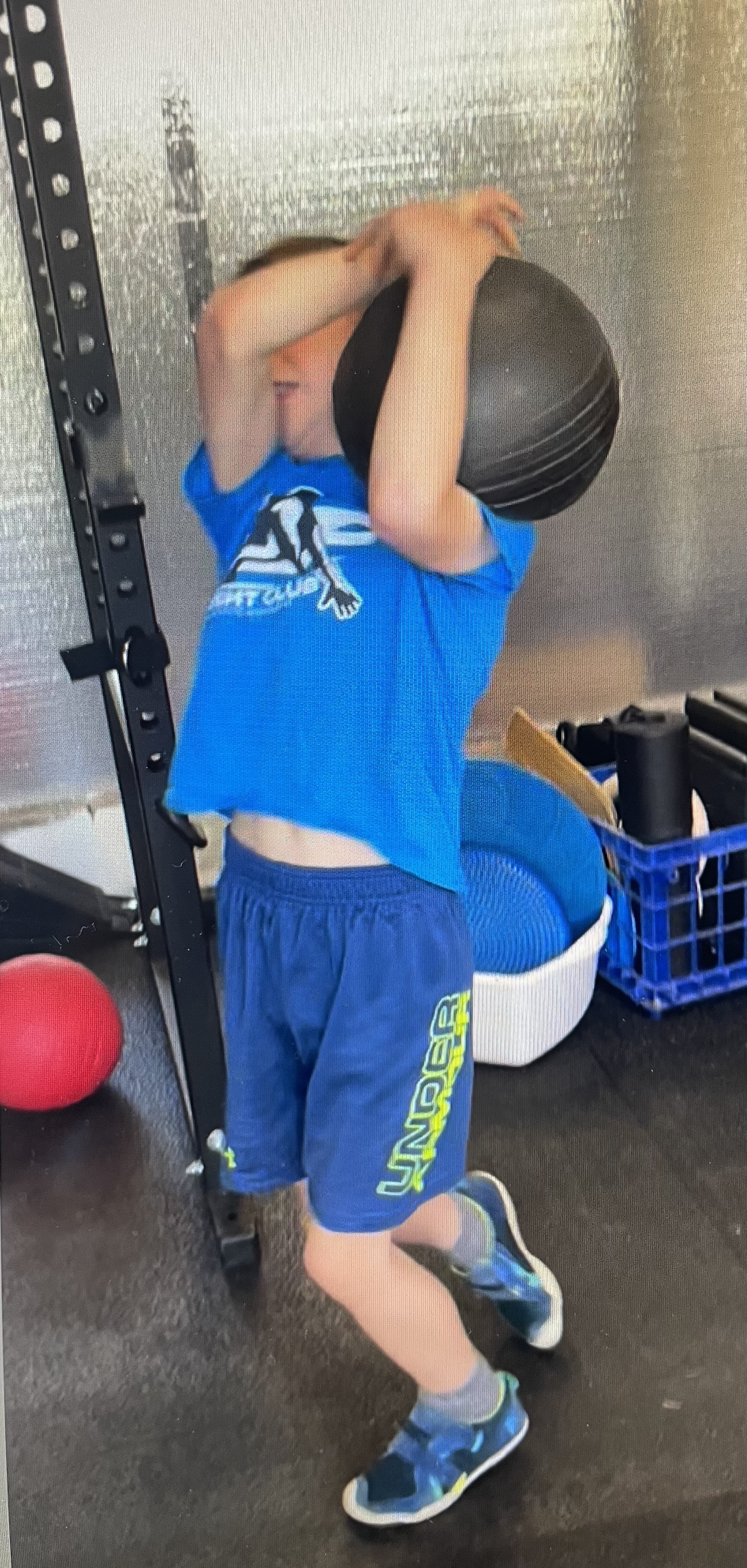 Slam ball stone throw 8 year old weight lifting youth athlete