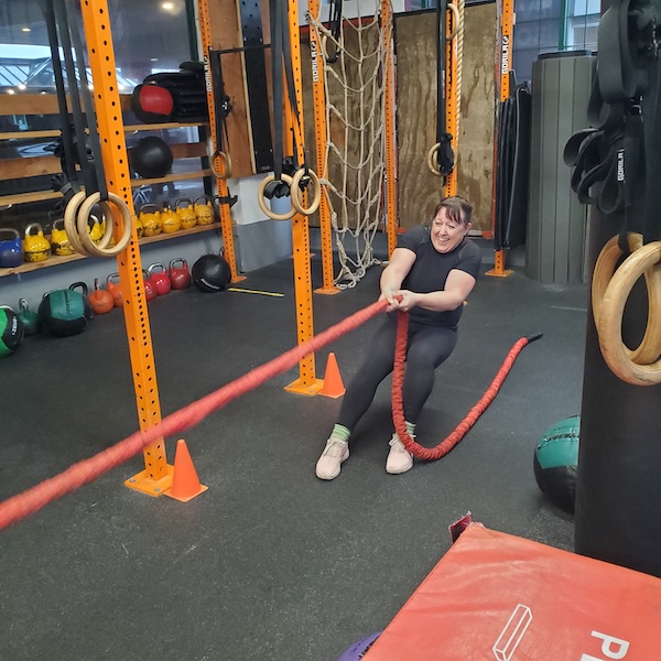 Female athlete doing rope work