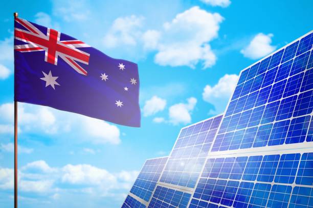 Australian flag with solar panels in the back ground. Australian flag with solar panels in the back ground.