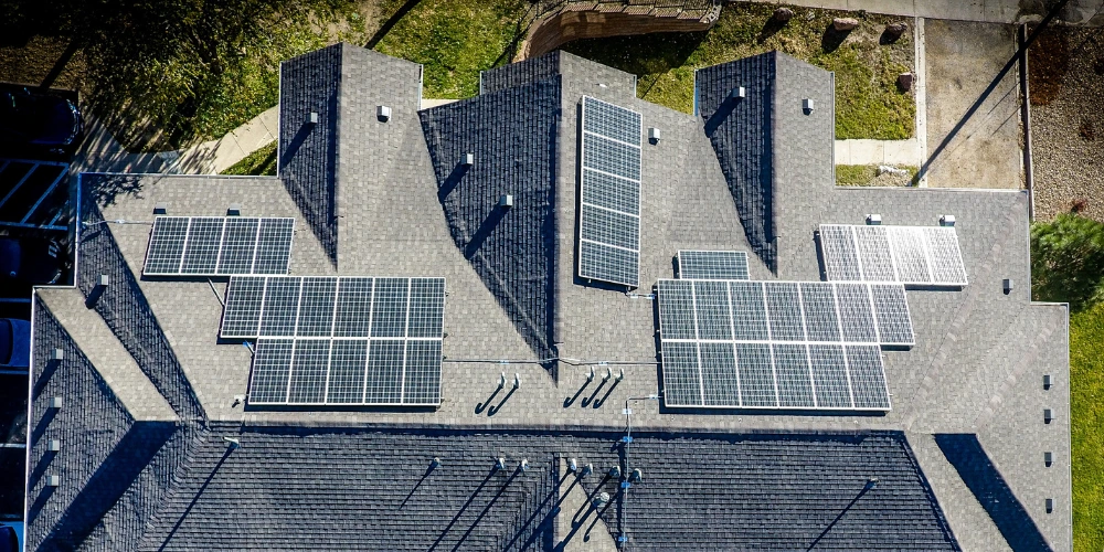 A residential property with a solar system installed where they've chosen a hybrid panel layout with solar panels facing multiple directions; north, east, and west. A residential property with a solar system installed where they've chosen a hybrid panel layout with solar panels facing multiple directions; north, east, and west.