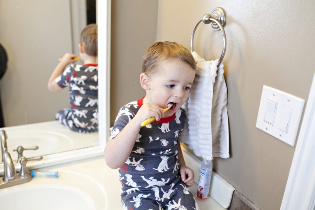 kid brushing teeth