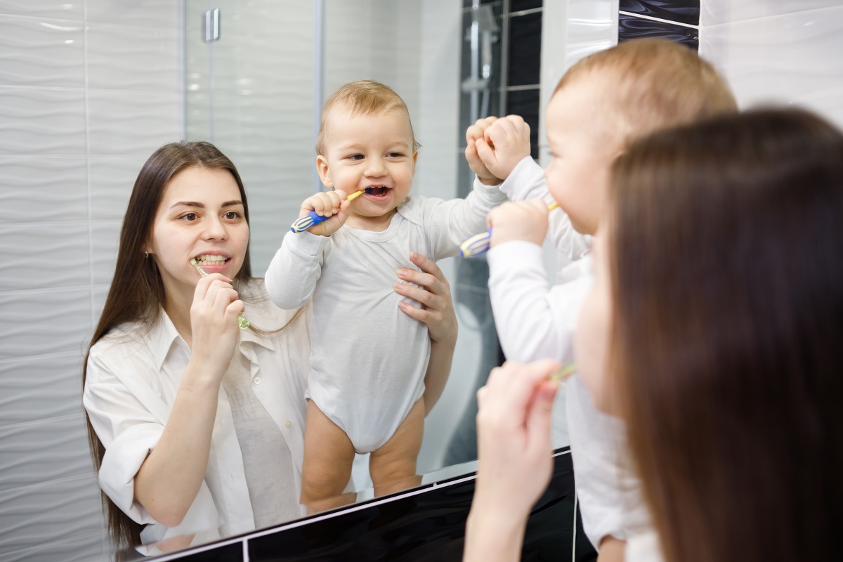 tooth care routine with mom and baby