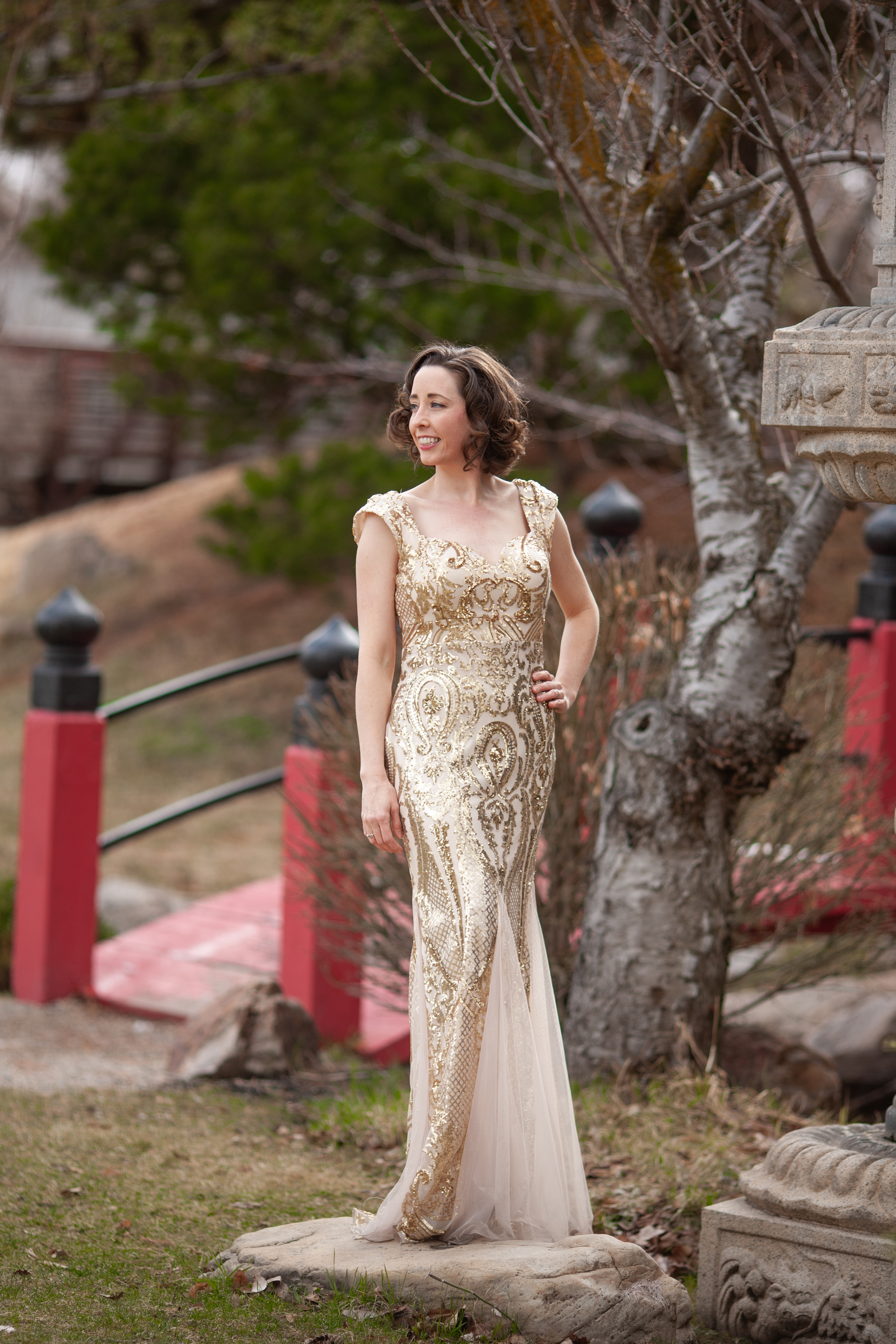 Beauty pageant contestant wearing a gold dress