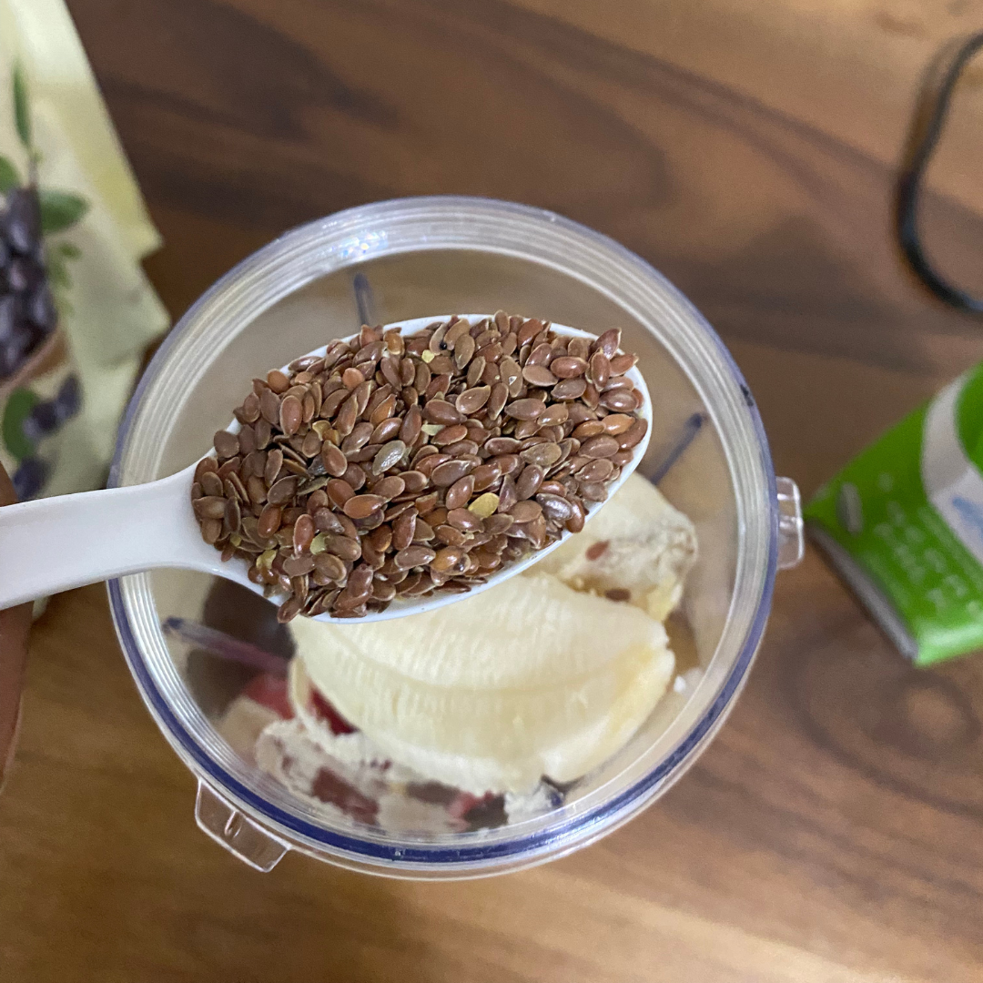 Flax seeds going into a blender Flax seeds going into a blender