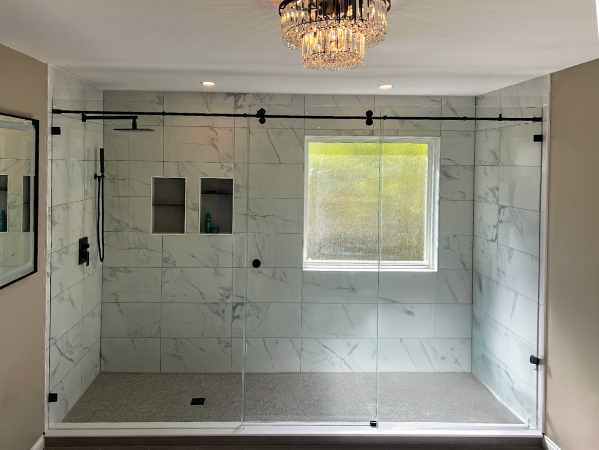 Custom frameless shower enclosure by A Touch of Glass