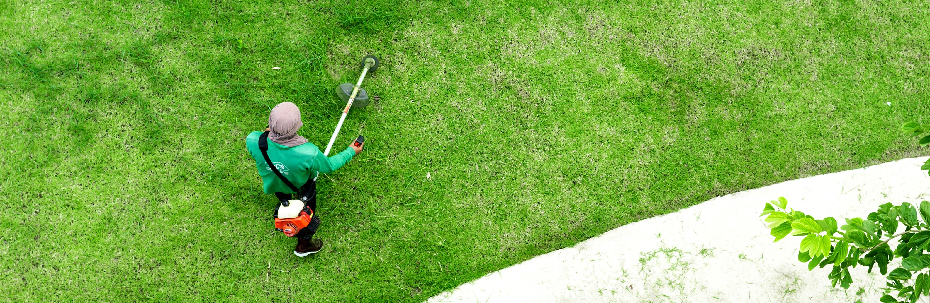 Lawn Care Employee Preforming Service Lawn Care Employee Preforming Service