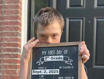Noahs holding a board Noahs holding a board