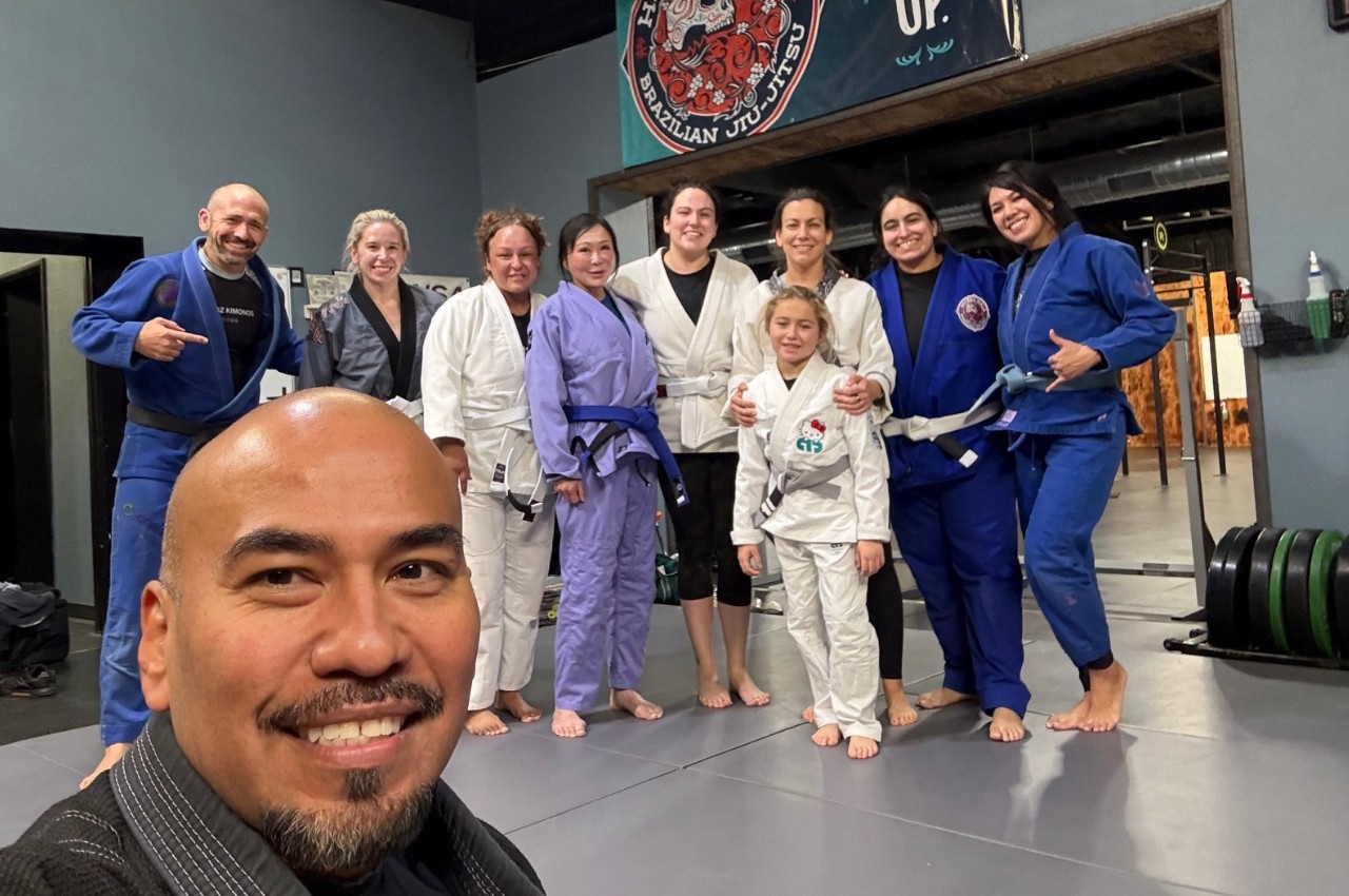 Women rolling in Brazilian Jiu-Jitsu