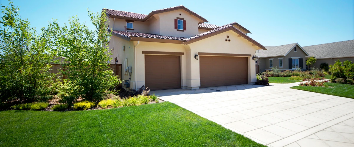 Spacious concrete driveway with three-car garage Spacious concrete driveway with three-car garage