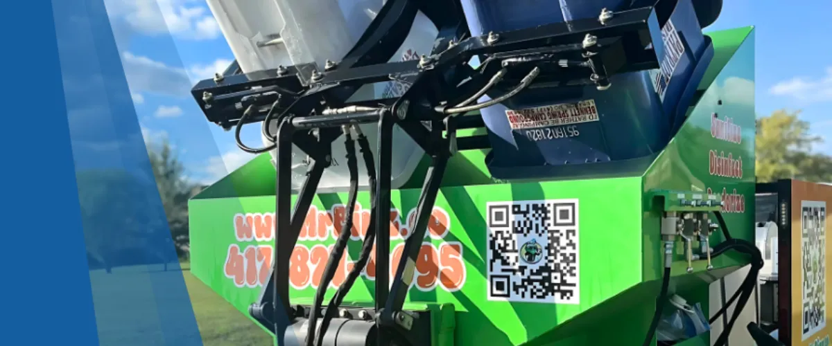 Close-up of Mr. Binz trash bin cleaning equipment lifting bins for sanitizing. Close-up of Mr. Binz trash bin cleaning equipment lifting bins for sanitizing.