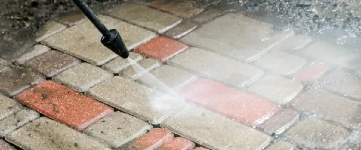 Brick paver driveway undergoing pressure cleaning. Brick paver driveway undergoing pressure cleaning.