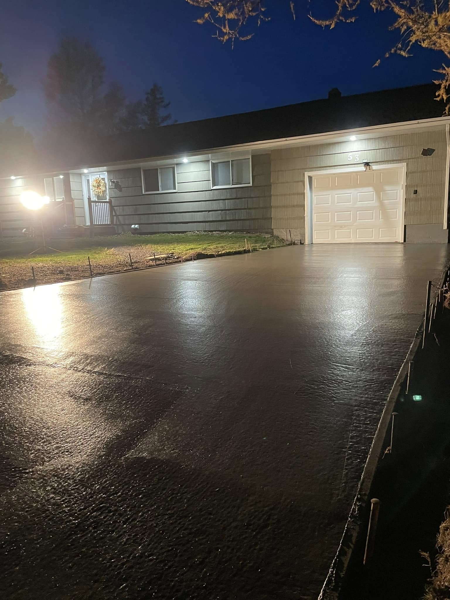 Concrete driveway drying after pouring by Langille's Excavation & Contracting in Pictou County, Nova Scotia, ensuring a durable and long-lasting surface. Concrete driveway drying after pouring by Langille's Excavation & Contracting in Pictou County, Nova Scotia, ensuring a durable and long-lasting surface.