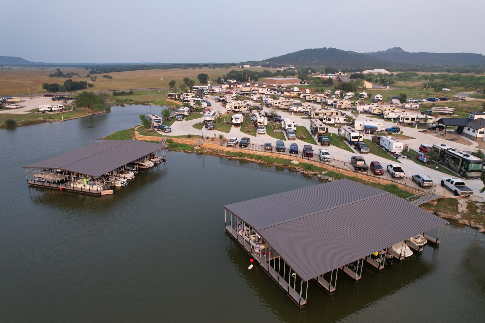 Covered boat slips at marina with power connections on Possum Kingdom Lake